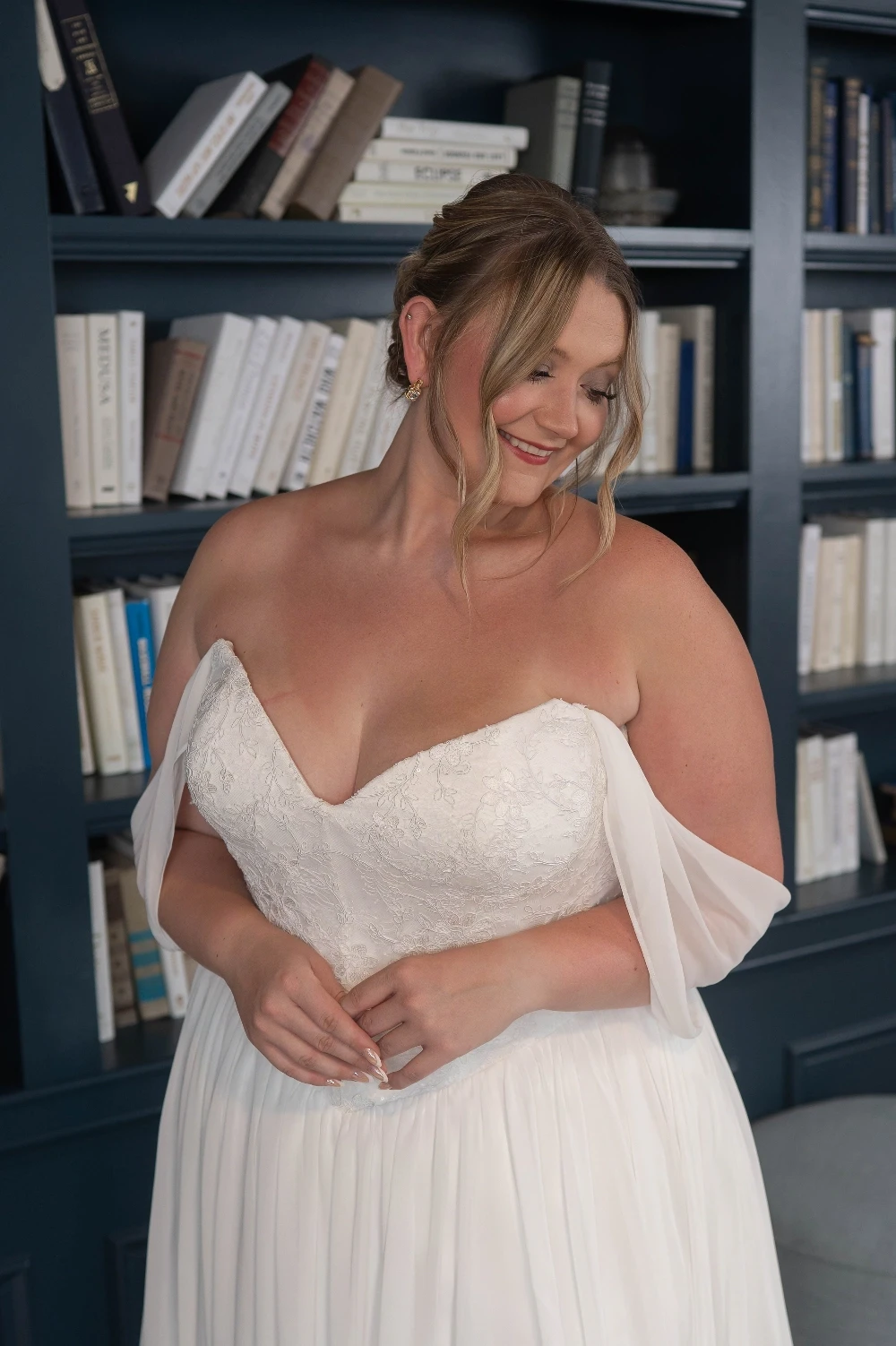 Bride wearing a plus size wedding dress at Formalities