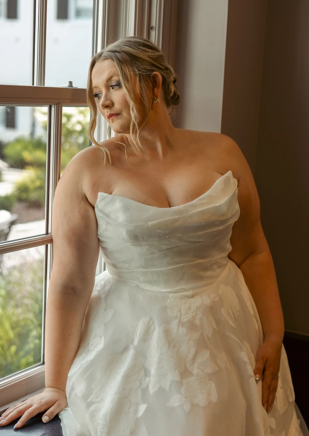 Bride wearing a plus size wedding dress with floral lace at Formalities in Bedford, PA