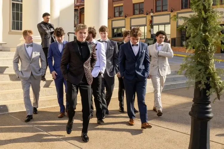 Boys walking to prom photos wearing prom tuxedos