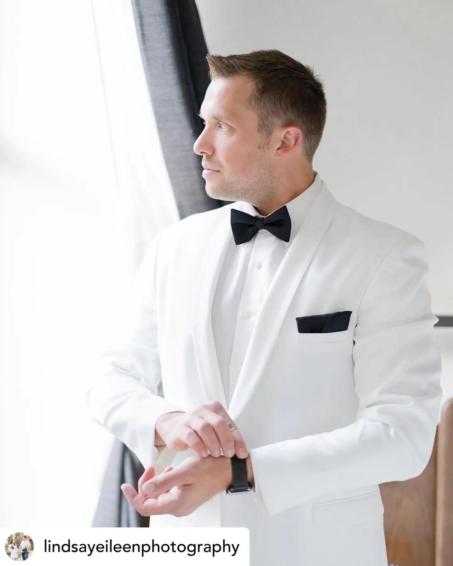 Model wearing a white suit